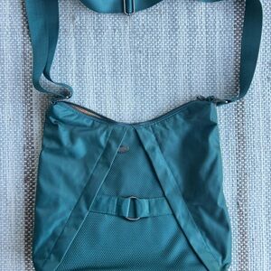 Lightweight multi-compartment nylon Italian crossbody bag ideal for travel.